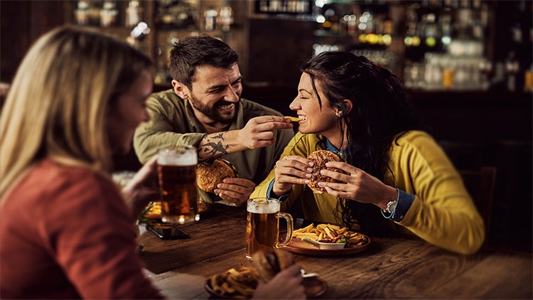 Couple Sharing Aviko Fries and Non Alcoholic Beer