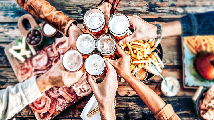 Group of Mates Sharing Non Alcoholic Beer and Aviko Fries 
