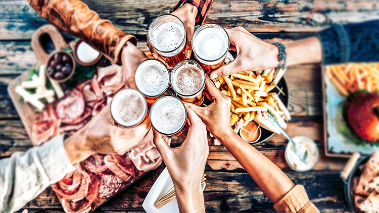 Group of Mates Sharing Non Alcoholic Beer and Aviko Fries