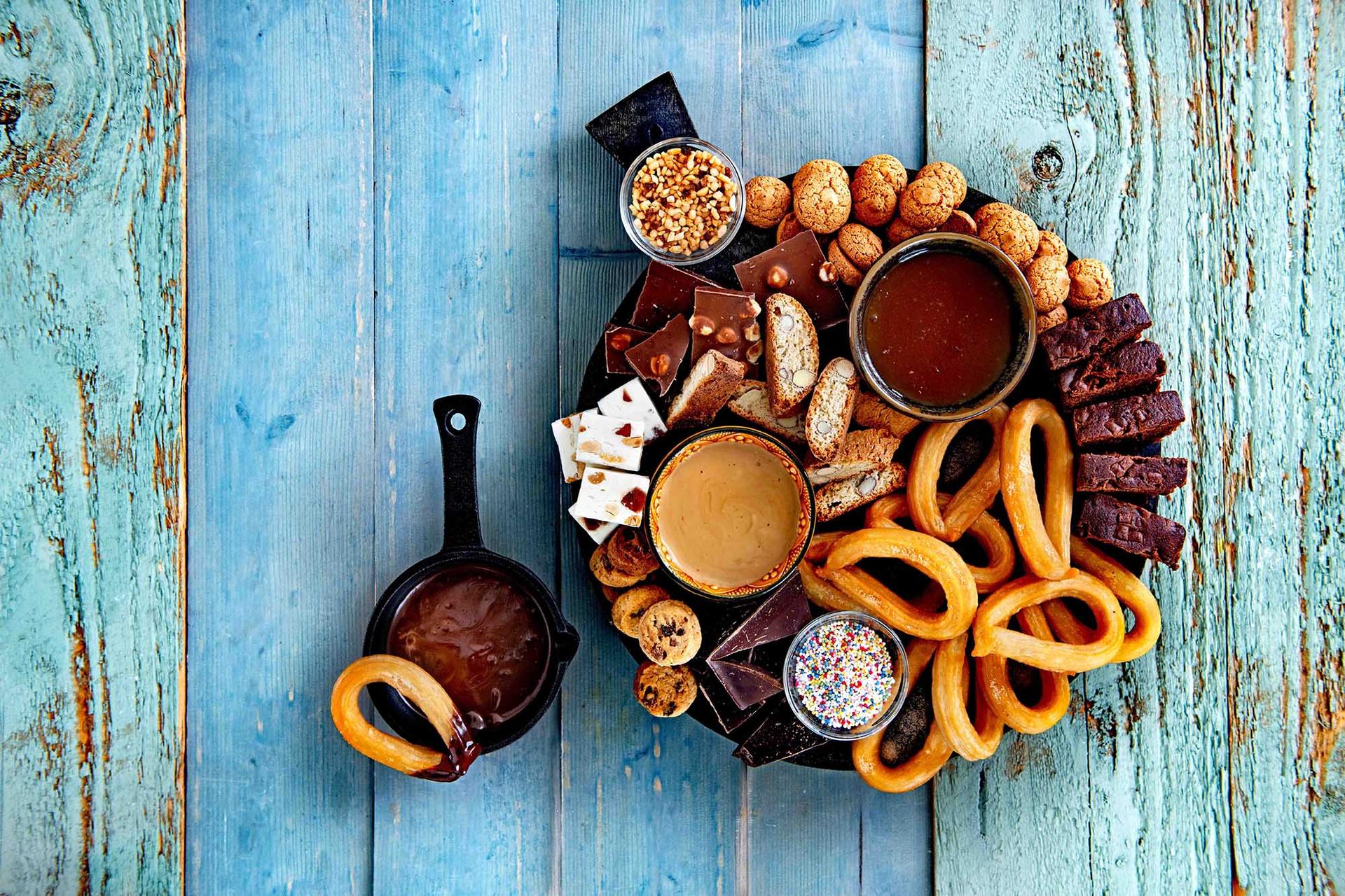 Sweet platter with chocolate cookies and churros