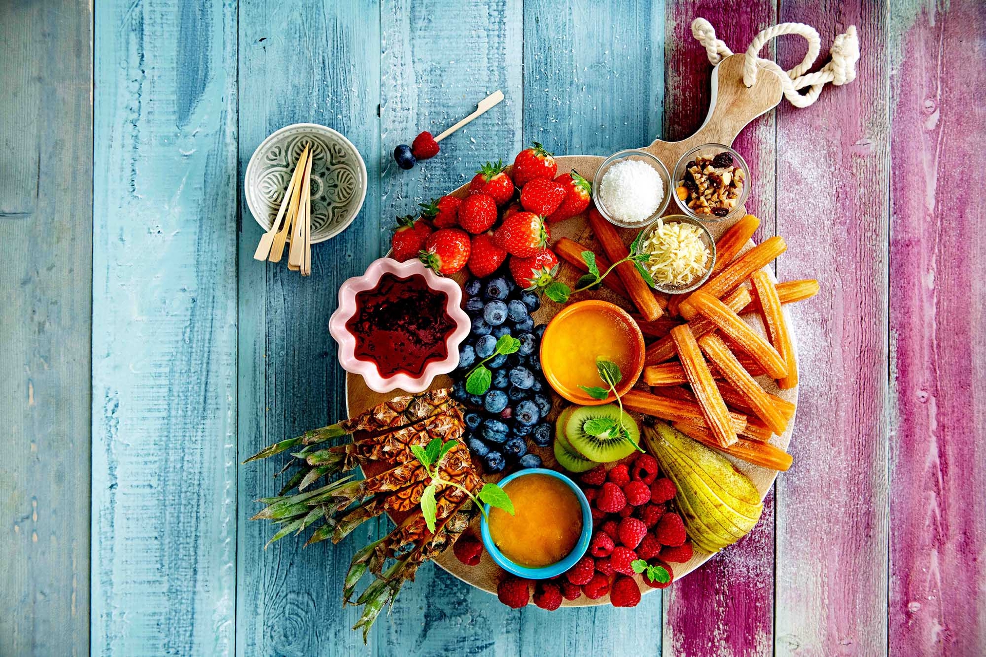 Fruity dessert platter with churros